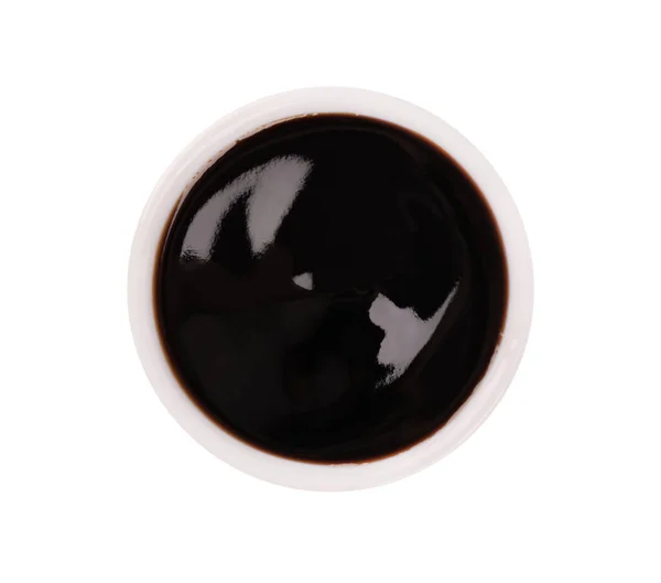 Teriyaki sosu kasede, beyaz arka planda izole edilmiş. Tatlı Japon sosu. Üst görünüm