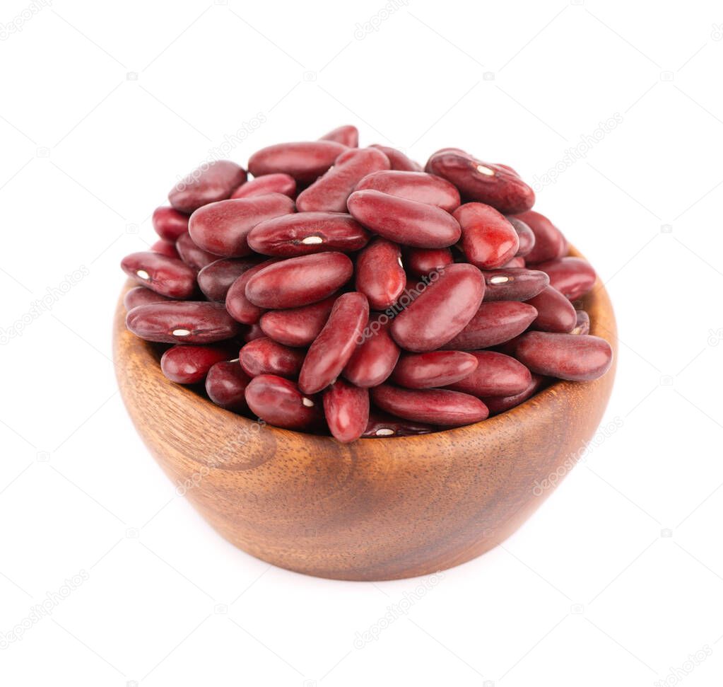 Red kidney beans in wooden bowl and spoon, isolated on white background. Rajma or Mexican Bean. Beans close up.