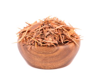 Lapacho herbal tea in wooden bowl, isolated on white background. Natural Taheeboo dry tea. Pau darco herb. Tabebuia heptophylla. clipart