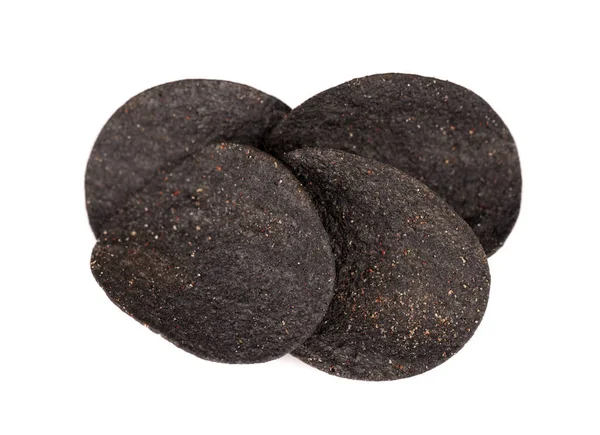 Black potato chips isolated on white background. Black chips with activated charcoal and red pepper. — Stock Photo, Image