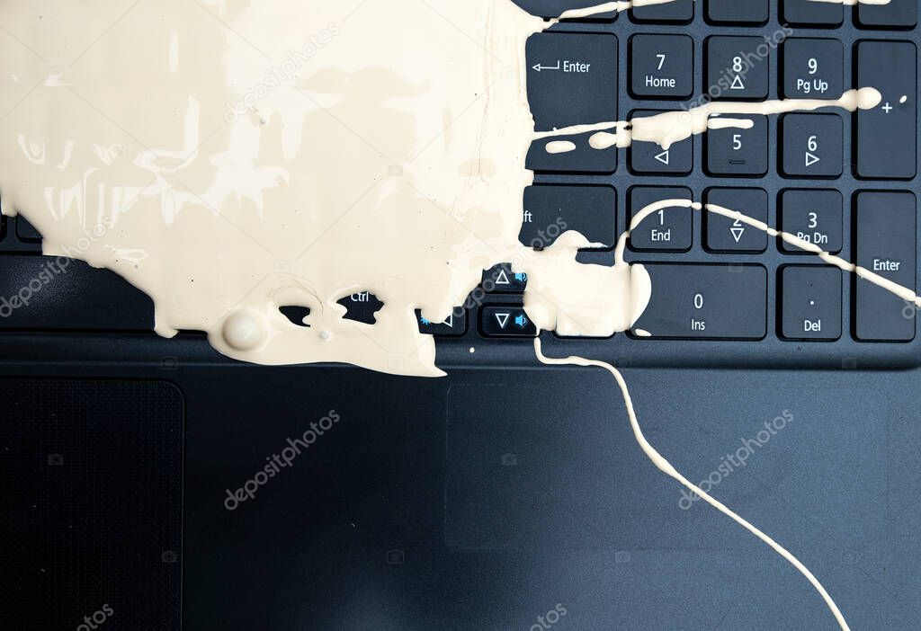 Spilled paint on a laptop keyboard