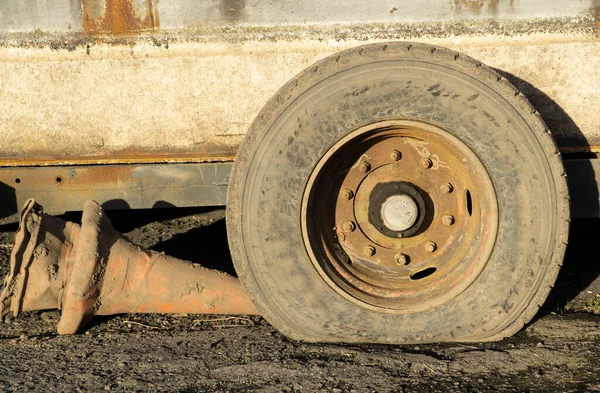 Dirty flat trailer tyre