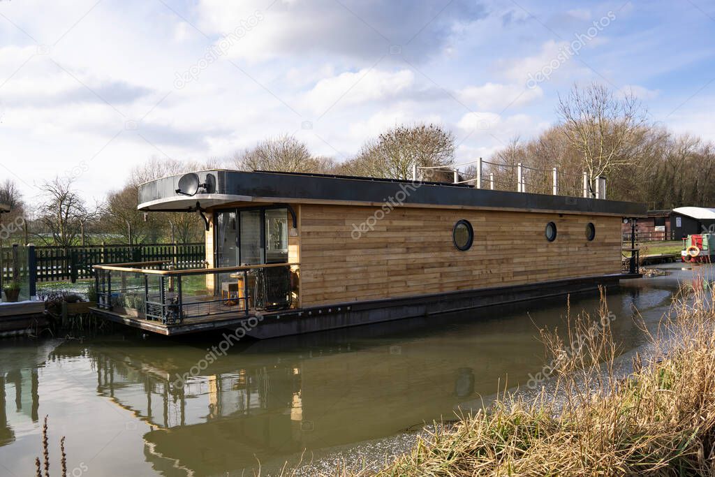Modern design house boat on acanal