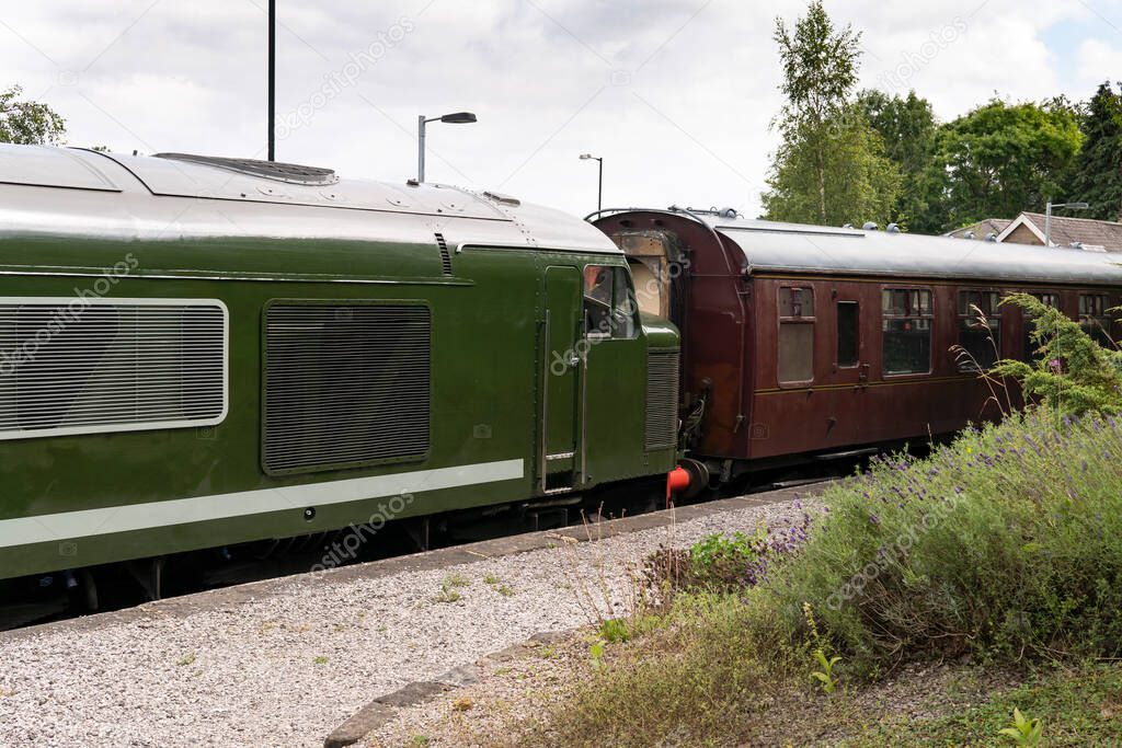 Old fashioned diesel locomotive and carriage