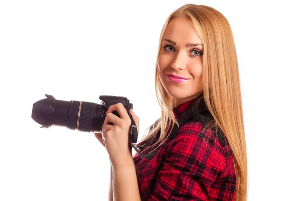 Attractive woman photographer at work with DSLR isolated over wh — Stock Photo, Image