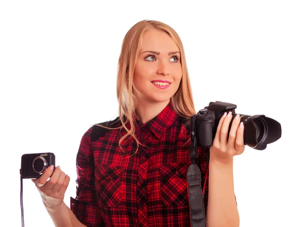Женщина фотограф выбор между двумя камерами - изолированы на w Лицензионные Стоковые Изображения