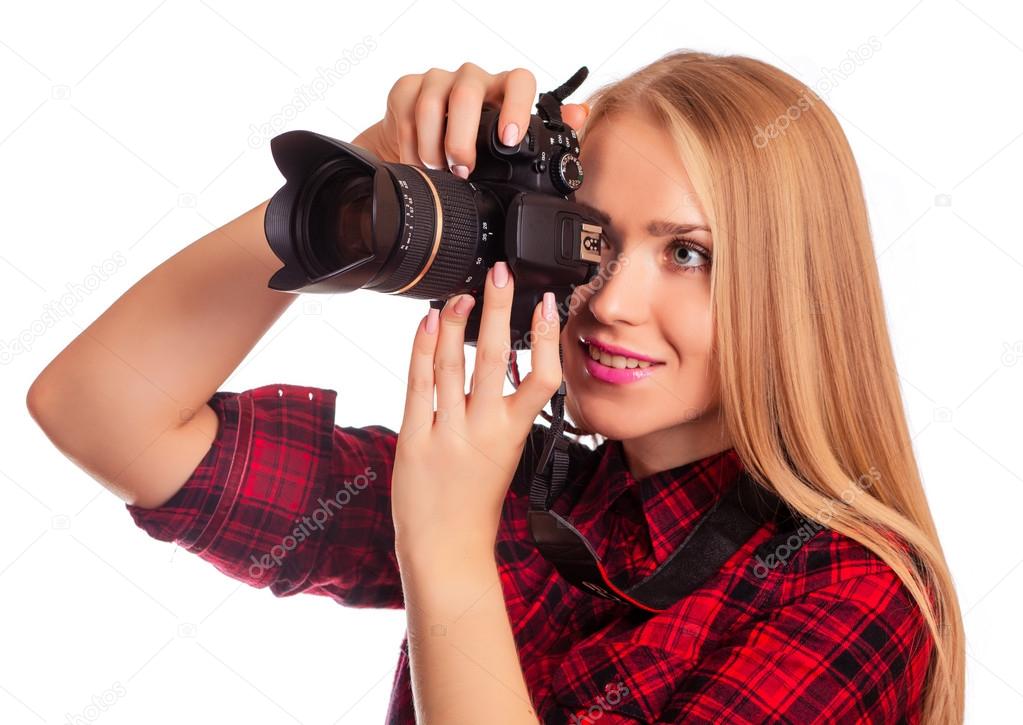 Glamour amateur photographer holding a professional camera - iso