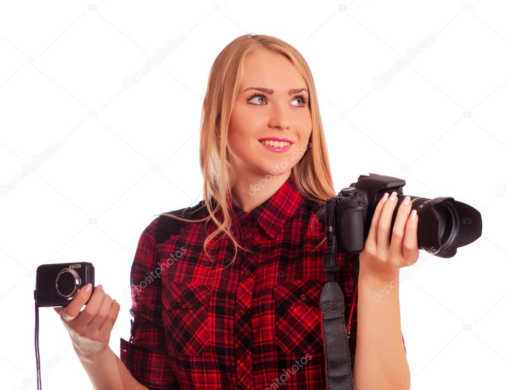 Female photographer choosing between two cameras - isolated on w