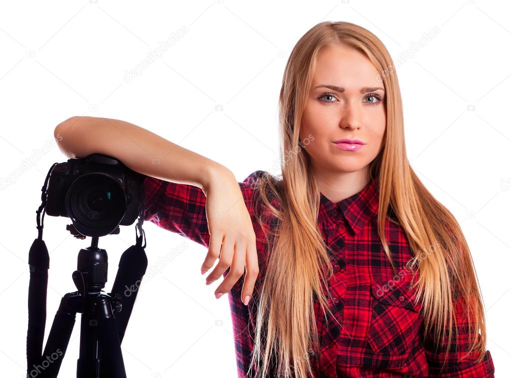 Attractive Woman photographer at work with DSLR