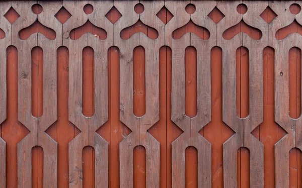 Patrón de decoración tallada en madera sobre fondo de madera — Foto de Stock