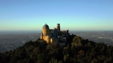 Aerial footage of colourful National Palace of Pena on sunset, Sintra, Portugal. High quality 4k footage