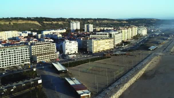 The Aerial footage of Costa da Caparica coastline and city, Portugal Лицензионные Стоковые Видео