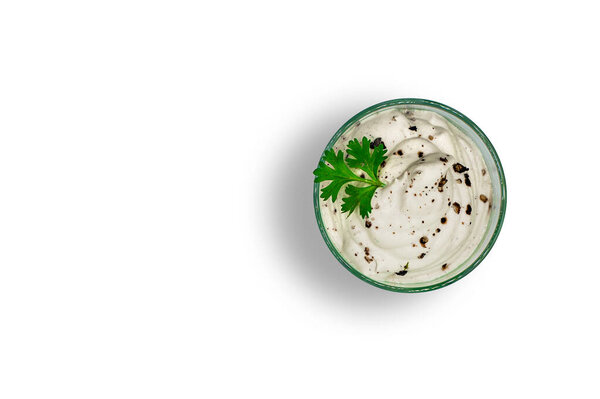 Vegan mayo isolated on a white background. Dairy free raw vegan organic healthy homemade cashew mayonnaise with black pepper and coriander on a top