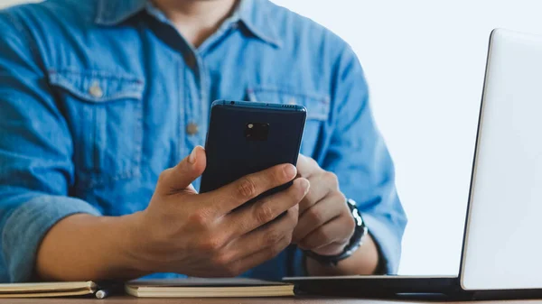 Close-up male hands with smartphone.