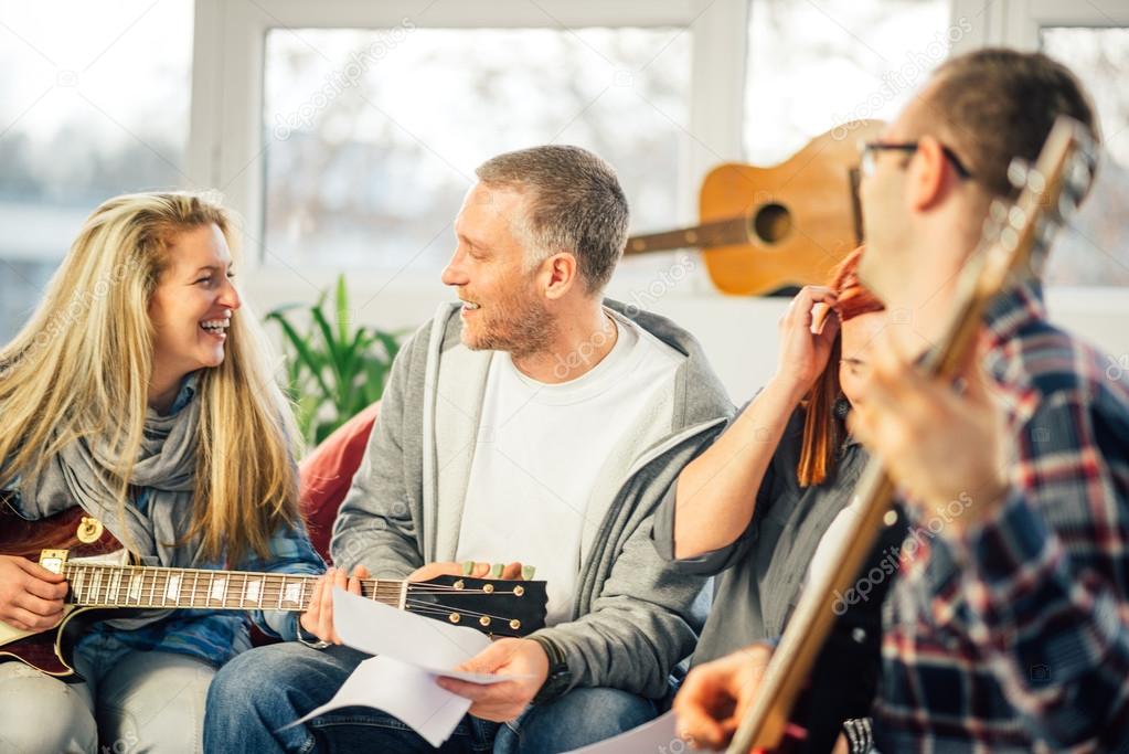 Home band learning new song together 