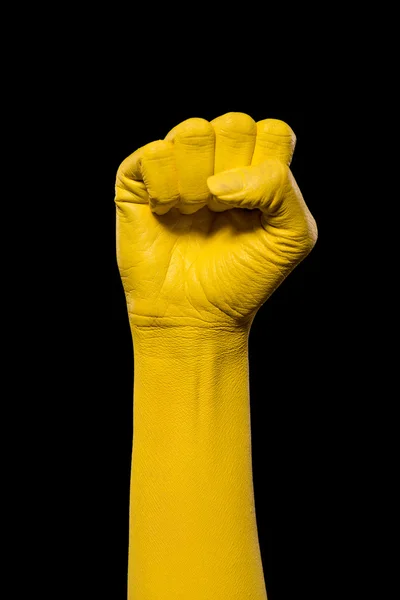 Yellow hand showing fist — Stock Photo, Image