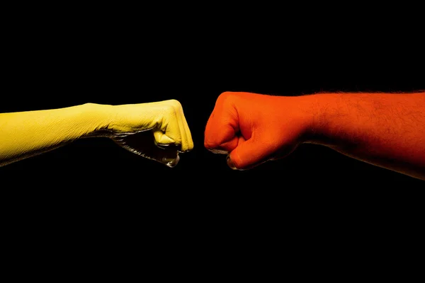 Manos rojas y amarillas —  Fotos de Stock