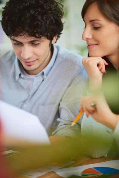 Man and woman discussing project Stock Photo