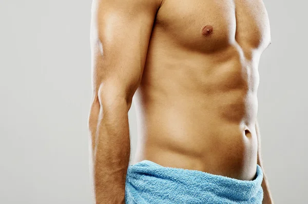 Muscular man in towel — Stock Photo, Image