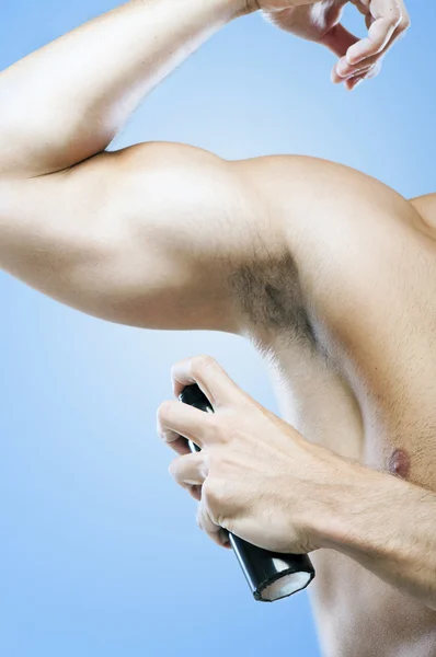 Man using deodorant — Stock Photo, Image