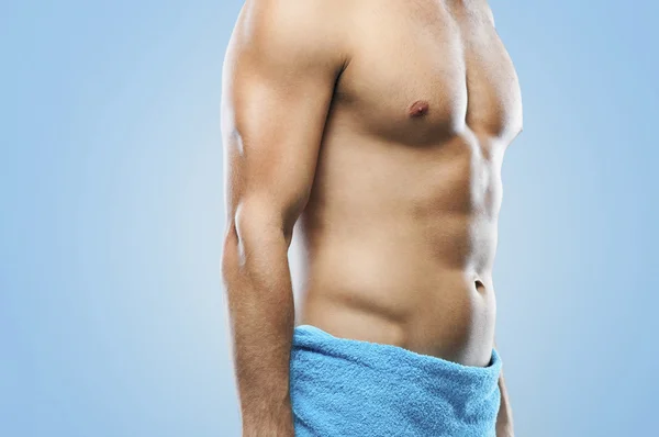 Muscular man in towel — Stock Photo, Image