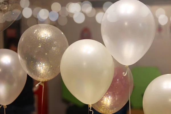 White balloons in party, decorating a room with balloons for holidays or birthday party event.