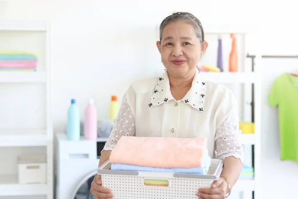 Happy Smiling Asian Senior Woman Housewife Carrying Clothes Basket Doing — стоковое фото