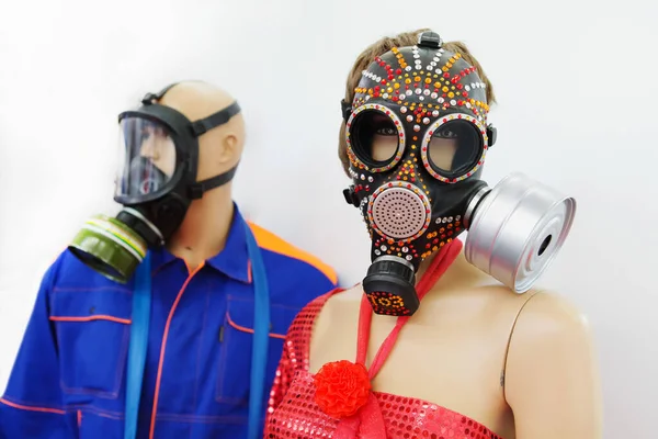 Mannequins of people in gas masks with multi-colored rhinestones. Protective mask against viruses and air pollution. Close-up.