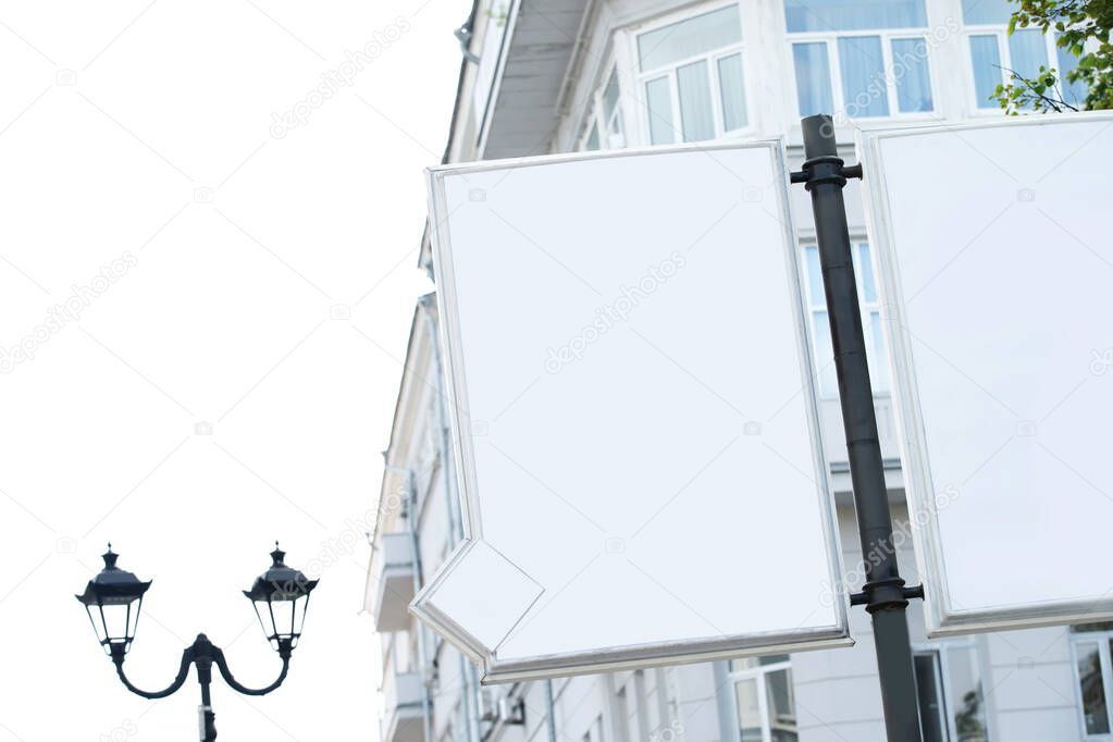 Advertising banner on the background of city houses. Blank for the designer. White space for labels