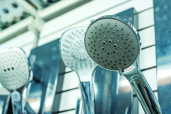 Assortment Shower Heads Plumbing Store Nozzles Different Types Shapes Showcase — Stock Photo, Image