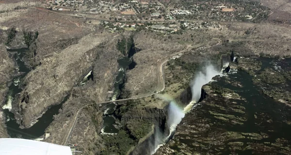A fault in the earth\'s crust along the course of the Zambezi River at Victoria Falls. Victoria Falls and the Zamezi Bridge on the border of Zimbabwe and Zambia from the plane.