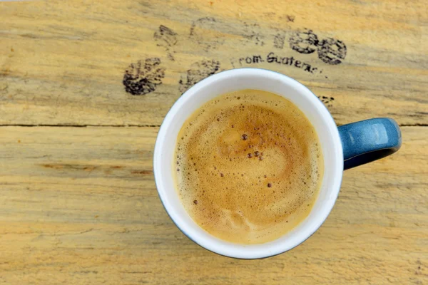 Blue coffee mug on old knotted wood with coffee text and empty space for layout — Φωτογραφία Αρχείου