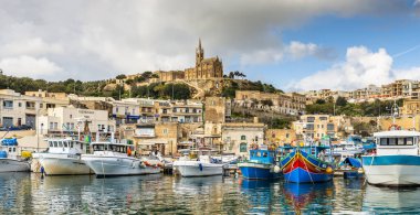 Port of the island of Gozo with its fishing boats, in Malta in the extreme south of Europe clipart
