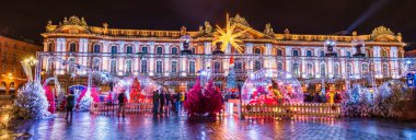 Decorations and Illuminations for the Christmas celebrations on the Place du Capitole at night, in Toulouse in Haute Garonne, Occitanie, France clipart