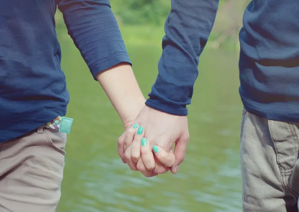 Loving couple holding hands — Stock Photo, Image