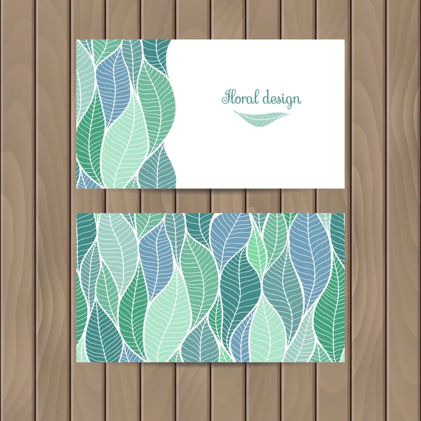 Vector business card with the texture of leaves on a wood background. — Stock Vector