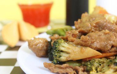 Beef Broccoli and Egg Roll on Plate at Chinese Restaurant
