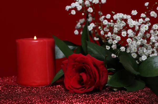 Red Rose With Red Candle on Red Velvet Background