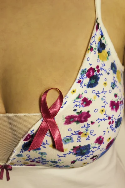 Girl breast and pink ribbon for breast cancer — Stock Photo, Image