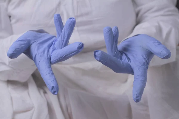 woman doctor wears medical gloves, medicine concept