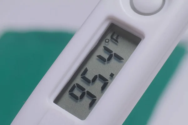 white digital thermometer close up stock photo