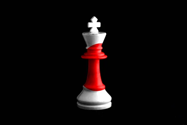 Image of a chess king with Japanese flag defeating white chess pieces. on black background.