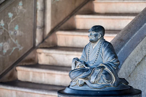 The crying monk statue in the Khoo Kongsi Temple that interplay sorrow in human existence