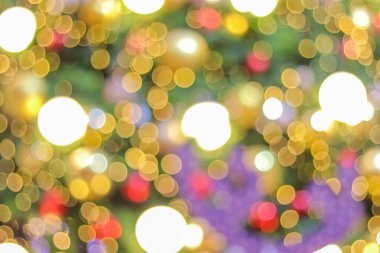 Yeni yılı kutlamak için Noel ışıkları tarafından oluşturulan bulanık bokeh arka plan. Güzel Noel ışıkları arka planı ve arka planı her tasarım ya da Noel tebrik kartı için kullanılabilir..