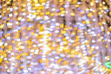 Yeni yılı kutlamak için Noel ışıkları tarafından oluşturulan bulanık bokeh arka plan. Güzel Noel ışıkları arka planı ve arka planı her tasarım ya da Noel tebrik kartı için kullanılabilir..