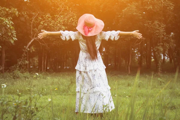 Smooth and Soft focus, A young girl prayed for God's blessings with the power and holiness of God On the background blurring the sunlight up in the morning.The concept of God and spirituality.