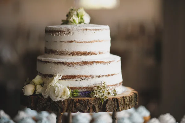 wedding cake on the wooden plate