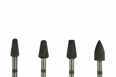 Diş cilası görüntüsü. Öğütücü alet. Mücevher aleti. Metal kesme aleti. Elmas alet. İyi iş çıkardın. Kusursuz cilalama.