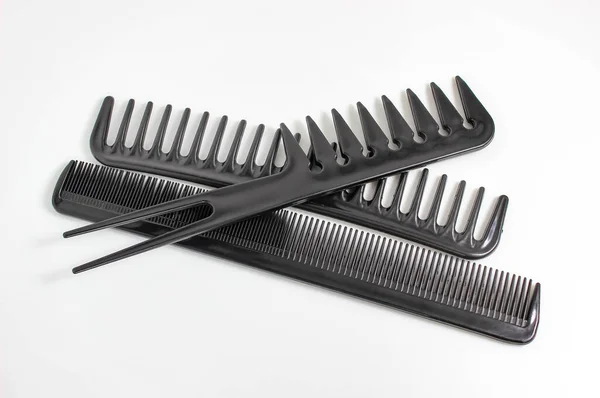 Several Different Black Combs White Background Selective Shot — Stock Photo, Image