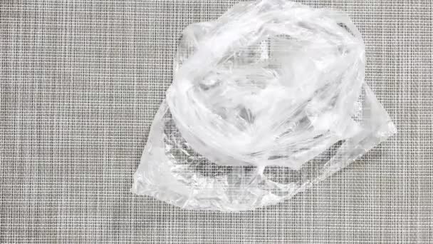 Stop Motion Animation Transparent Household Cellophane Bag Neatly Folded Top — Stock Video